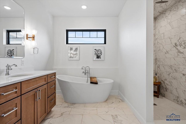 bathroom featuring a walk in shower, marble finish floor, vanity, and a wealth of natural light
