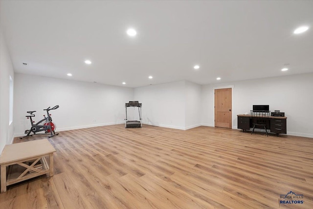 interior space featuring baseboards, recessed lighting, and light wood finished floors