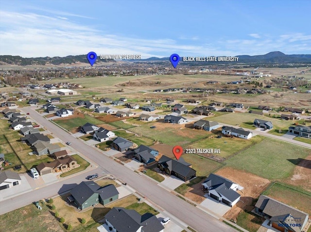drone / aerial view with a mountain view and a residential view