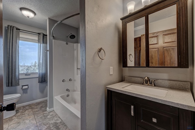 7497 Tanager Dr, Rapid City, SD 57702 - full bath with shower / washtub combination, a textured ceiling, vanity, toilet, and baseboards