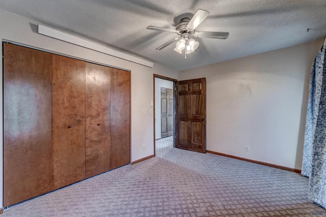 7497 Tanager Dr, Rapid City, SD 57702 - unfurnished bedroom featuring a closet, ceiling fan, baseboards, and carpet