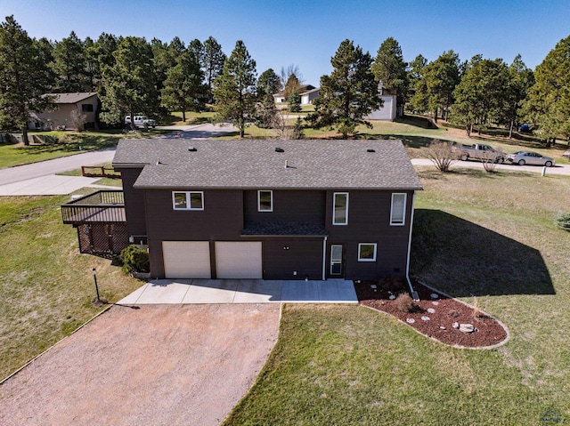 7497 Tanager Dr, Rapid City, SD 57702 - view of front of house with an attached garage, roof with shingles, a front yard, and dirt driveway