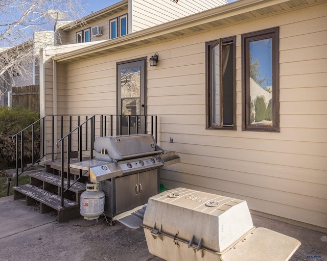exterior space featuring fence and a grill