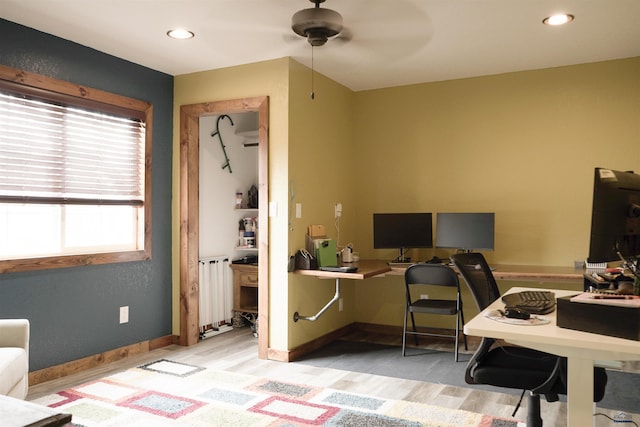 2412 Cameron Dr, Rapid City, SD 57702 - office featuring radiator, light wood finished floors, ceiling fan, and baseboards