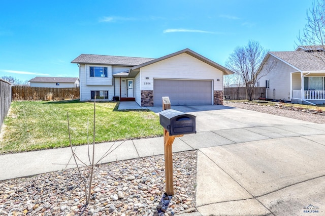 2906 Benjamin, Rapid City, SD 57703 - view of front of house with a garage, a front yard, fence, and concrete driveway