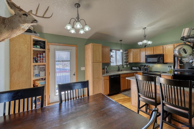 2906 Benjamin, Rapid City, SD 57703 - kitchen featuring an inviting chandelier, a textured ceiling, vaulted ceiling, black appliances, and hanging light fixtures