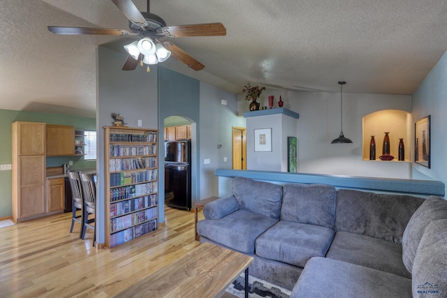 2906 Benjamin, Rapid City, SD 57703 - living room with a ceiling fan, light wood-style flooring, a textured ceiling, and lofted ceiling