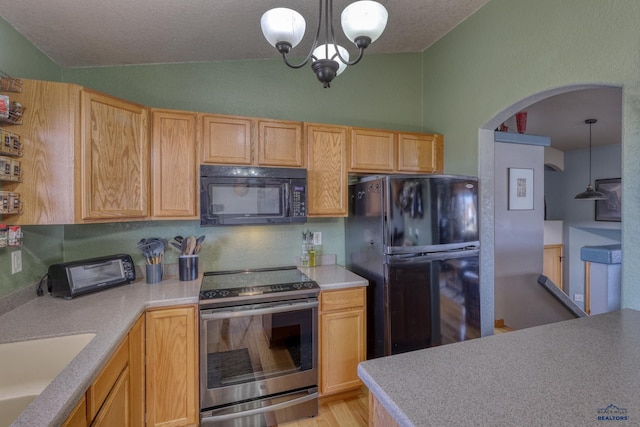 2906 Benjamin, Rapid City, SD 57703 - kitchen with arched walkways, vaulted ceiling, black appliances, a sink, and light countertops