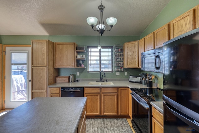 2906 Benjamin, Rapid City, SD 57703 - kitchen featuring a textured ceiling, a sink, black appliances, and hanging light fixtures