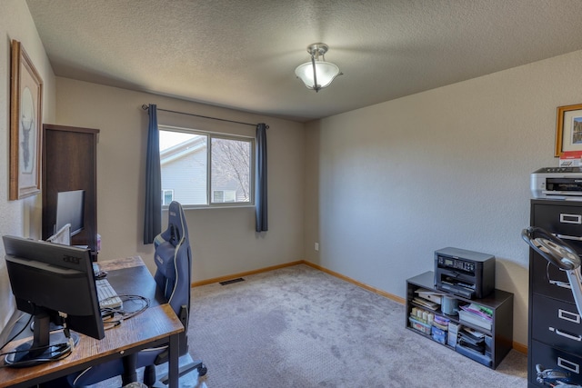 2906 Benjamin, Rapid City, SD 57703 - office area featuring visible vents, a textured ceiling, baseboards, and carpet floors