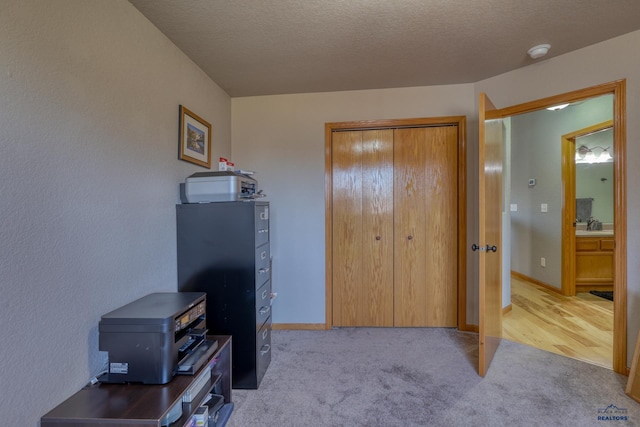 2906 Benjamin, Rapid City, SD 57703 - bedroom featuring light carpet, a closet, and a textured ceiling