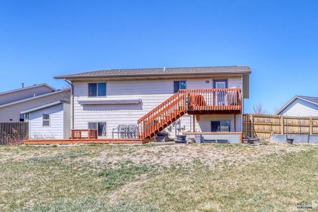 2906 Benjamin, Rapid City, SD 57703 - rear view of property featuring central air condition unit, stairway, a lawn, fence, and a deck