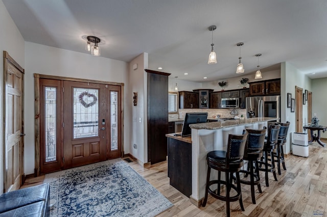 20694 Roosevelt Ct, Sturgis, SD 57785 - foyer featuring light wood-type flooring, baseboards, and recessed lighting