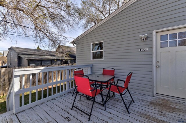 1021 Haines Ave, Rapid City, SD 57701 - wooden terrace featuring outdoor dining area