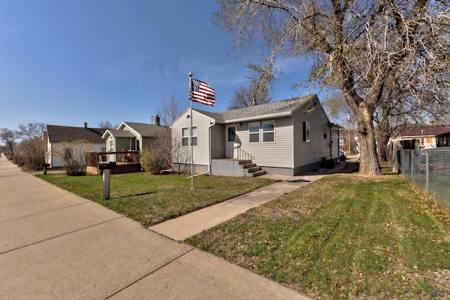 1021 Haines Ave, Rapid City, SD 57701 - bungalow-style home featuring a front yard and fence