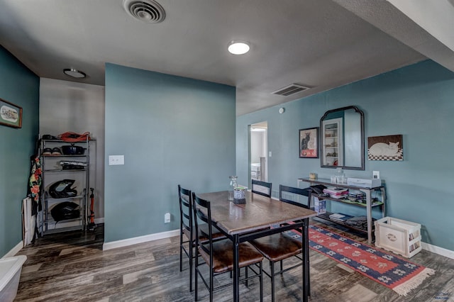 1021 Haines Ave, Rapid City, SD 57701 - dining space featuring wood finished floors, baseboards, and visible vents