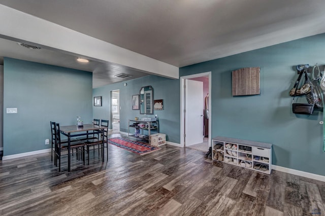1021 Haines Ave, Rapid City, SD 57701 - dining area with wood finished floors, baseboards, and visible vents