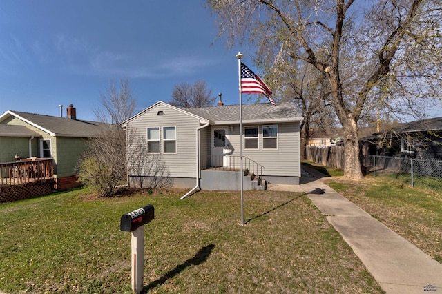 1021 Haines Ave, Rapid City, SD 57701 - bungalow-style house with fence and a front lawn