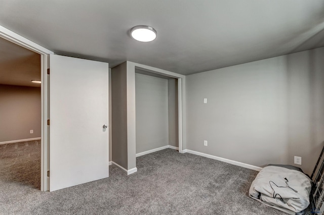 1021 Haines Ave, Rapid City, SD 57701 - unfurnished bedroom featuring a closet, baseboards, and carpet floors