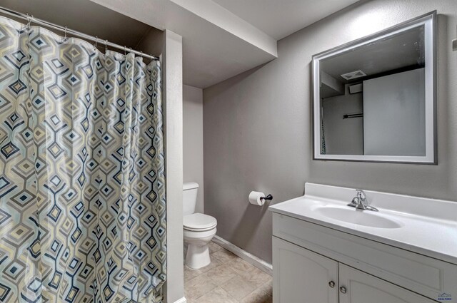 1021 Haines Ave, Rapid City, SD 57701 - full bathroom with vanity, baseboards, tile patterned flooring, toilet, and visible vents