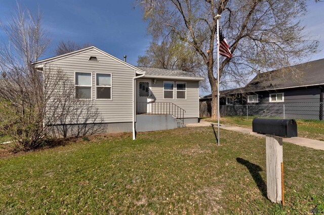 1021 Haines Ave, Rapid City, SD 57701 - view of front facade featuring a front yard and fence