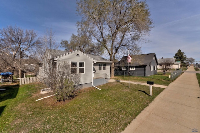 1021 Haines Ave, Rapid City, SD 57701 - view of home's exterior featuring a yard and fence