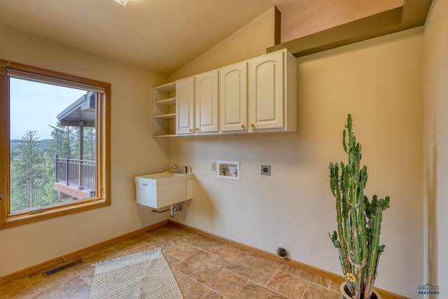 8000 Meadow View Ct, Rapid City, SD 57702 - laundry room featuring hookup for an electric dryer, baseboards, visible vents, hookup for a washing machine, and cabinet space