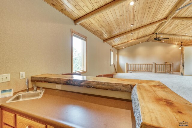 8000 Meadow View Ct, Rapid City, SD 57702 - bonus room featuring a ceiling fan, wooden ceiling, carpet flooring, a sink, and vaulted ceiling with beams