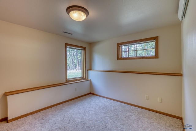 8000 Meadow View Ct, Rapid City, SD 57702 - empty room with carpet flooring, visible vents, and plenty of natural light