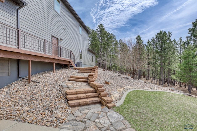 8000 Meadow View Ct, Rapid City, SD 57702 - view of yard featuring central AC, stairway, and a deck