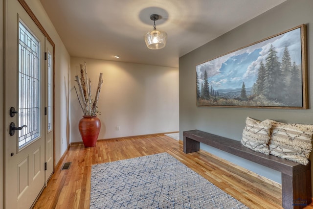 8000 Meadow View Ct, Rapid City, SD 57702 - entrance foyer featuring visible vents, light wood-style flooring, and baseboards