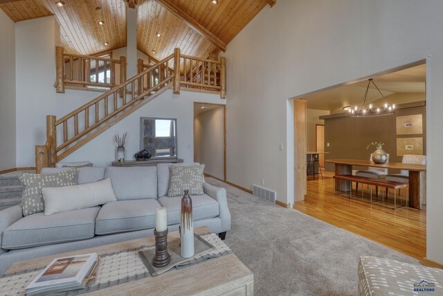 8000 Meadow View Ct, Rapid City, SD 57702 - living room featuring high vaulted ceiling, visible vents, wood ceiling, stairs, and a notable chandelier