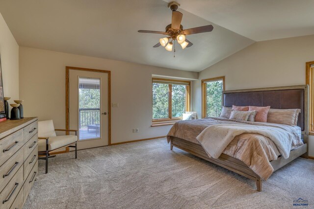 8000 Meadow View Ct, Rapid City, SD 57702 - bedroom featuring access to outside, multiple windows, vaulted ceiling, and light carpet