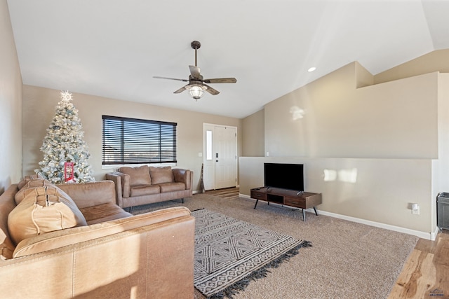 living area featuring light wood-style flooring, ceiling fan, baseboards, and vaulted ceiling