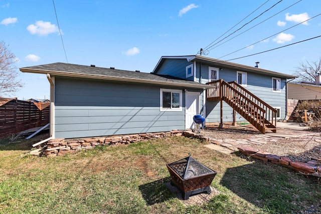 6001 Northdale Dr, Black Hawk, SD 57718 - rear view of house with a yard, fence, a fire pit, and stairway