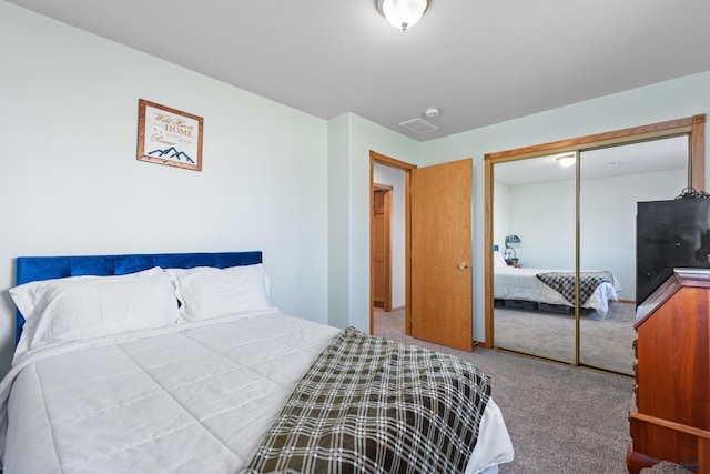 323 Freiheit Ln, Box Elder, SD 57719 - bedroom featuring a closet, visible vents, and carpet