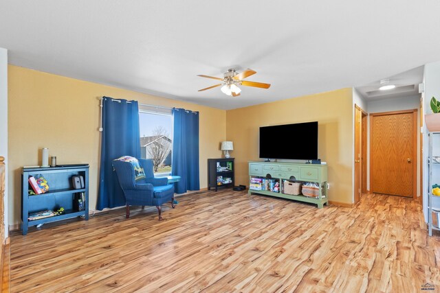 323 Freiheit Ln, Box Elder, SD 57719 - living area with a ceiling fan and wood finished floors