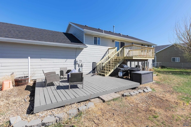 323 Freiheit Ln, Box Elder, SD 57719 - rear view of house with fence, a wooden deck, and stairway
