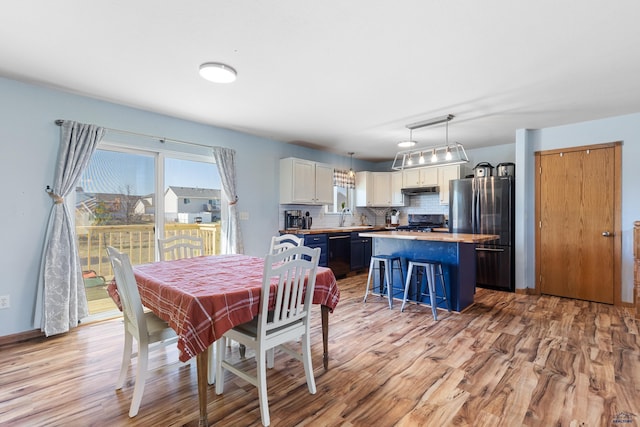 323 Freiheit Ln, Box Elder, SD 57719 - dining area with light wood-style floors
