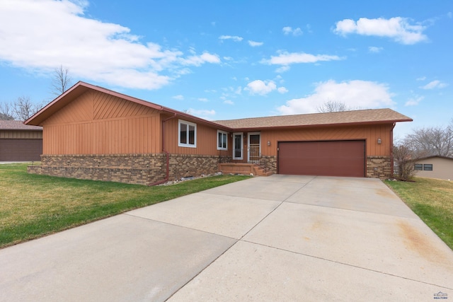 2713 Harney Pl, Rapid City, SD 57702 - single story home with brick siding, driveway, a front lawn, and a garage