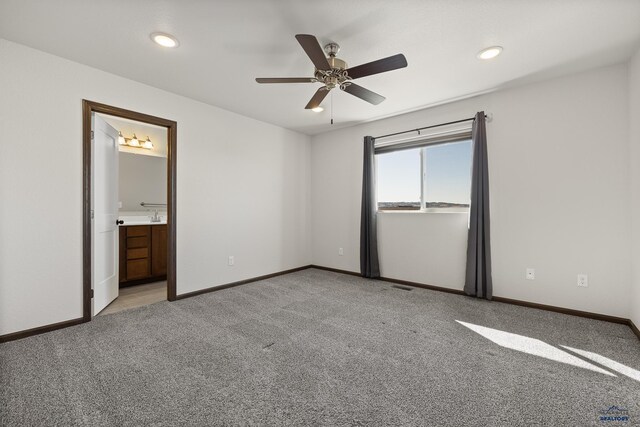 4425 Beringer Dr, Rapid City, SD 57703 - unfurnished bedroom with light colored carpet, baseboards, recessed lighting, ensuite bathroom, and a ceiling fan