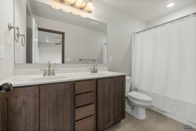 4425 Beringer Dr, Rapid City, SD 57703 - full bath with toilet, double vanity, and shower / tub combo with curtain