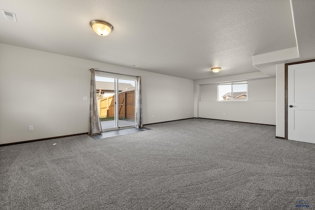 4425 Beringer Dr, Rapid City, SD 57703 - empty room featuring carpet, baseboards, and a textured ceiling