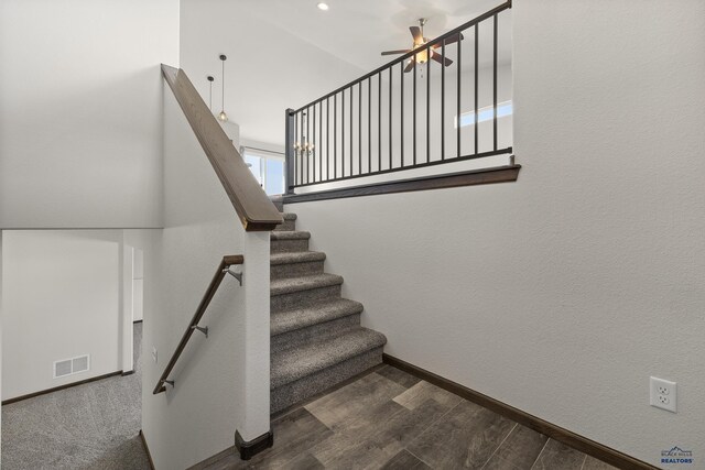 4425 Beringer Dr, Rapid City, SD 57703 - stairway featuring a ceiling fan, wood finished floors, and baseboards