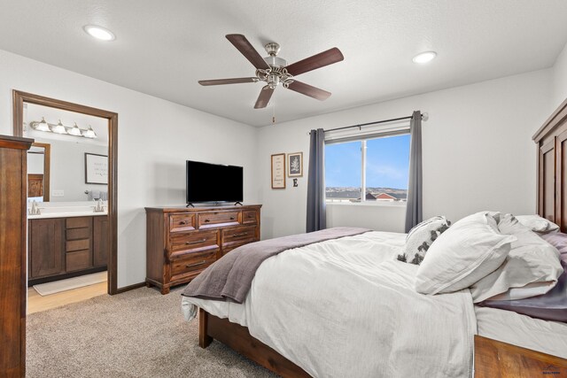 4425 Beringer Dr, Rapid City, SD 57703 - bedroom with light carpet, connected bathroom, recessed lighting, ceiling fan, and baseboards
