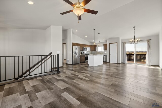4425 Beringer Dr, Rapid City, SD 57703 - unfurnished living room featuring a chandelier, lofted ceiling, recessed lighting, ceiling fan, and dark wood-style floors