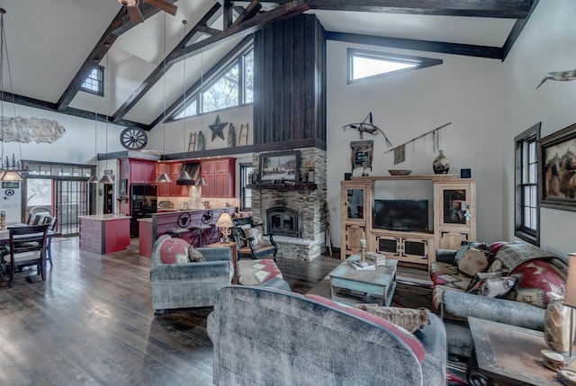 101/109 Sherman St, Rapid City, SD 57702 - living area with high vaulted ceiling, a stone fireplace, beam ceiling, and wood finished floors