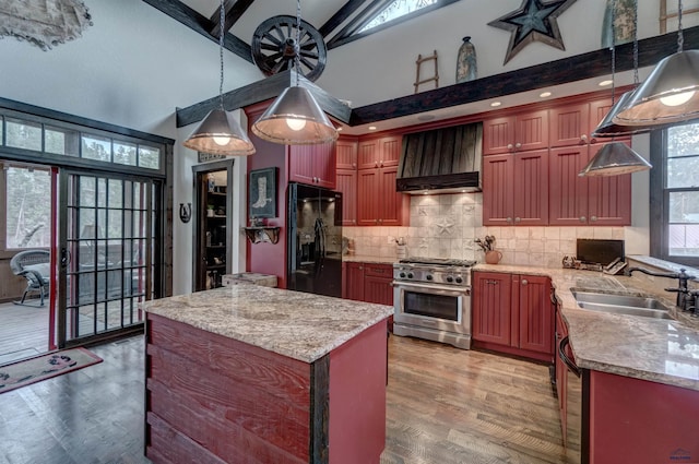 101/109 Sherman St, Rapid City, SD 57702 - kitchen featuring a sink, custom exhaust hood, black refrigerator with ice dispenser, high vaulted ceiling, and stainless steel stove
