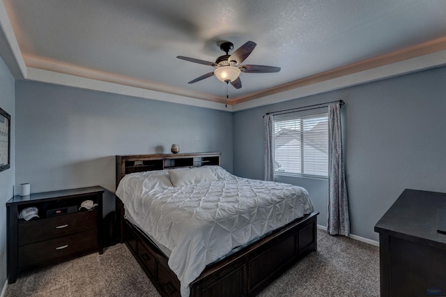 bedroom featuring baseboards, light colored carpet, and ceiling fan