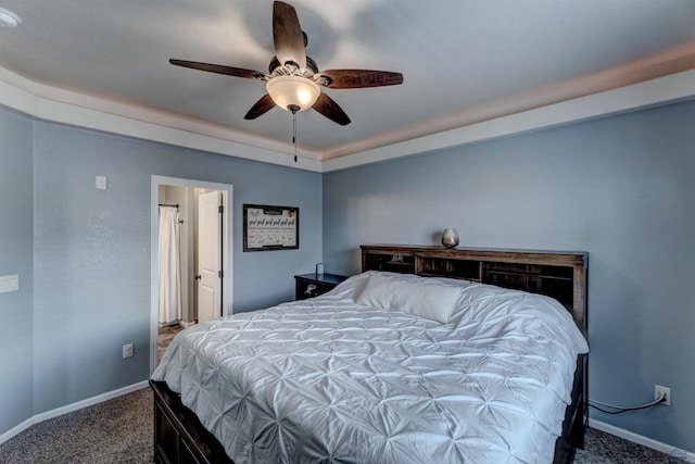 carpeted bedroom featuring baseboards and ceiling fan